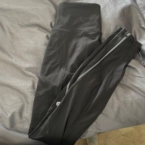 Lululemon leggings with zipper pockets and reflective on bottom of leg